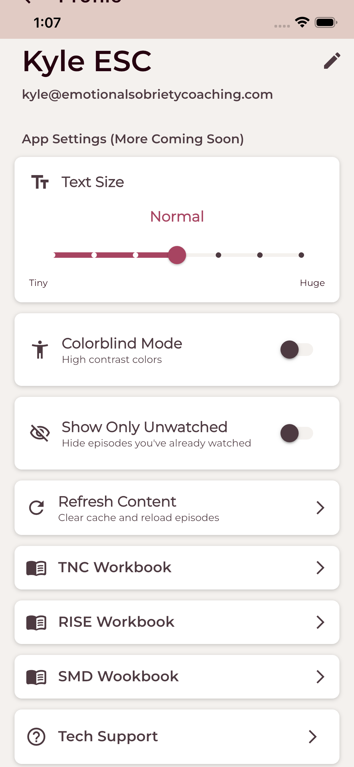 Profile and app settings with text size, colorblind mode, workbooks, and tech support